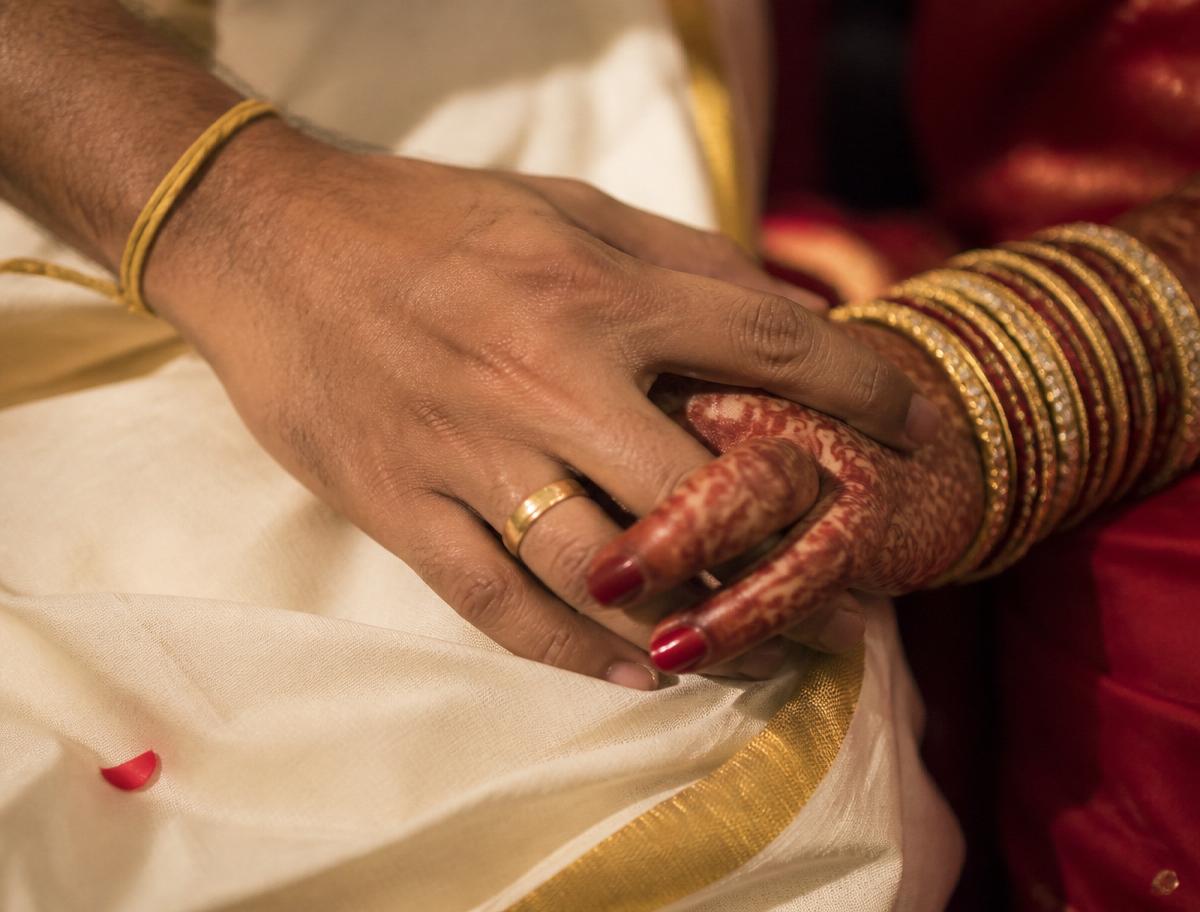 Bride and groom hands with henna